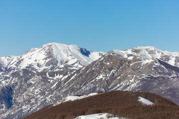 Fototapeta premium panorama of Monte Miletto and Monte Gallinola with snow, the highest peaks of the Matese massif. Matese National Park, Campania and Molise, Italy