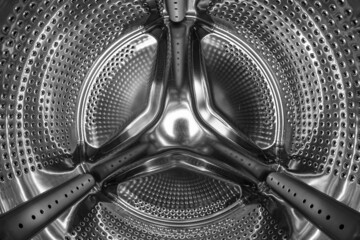 Washing machine drum inside. Black and white photo