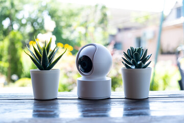 Video surveillance equipment on the table. Compact security camera for outdoor or private home...