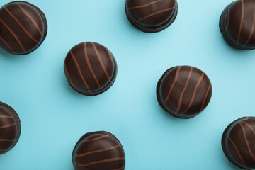 Chocolate sweets on a blue background. Biscuit