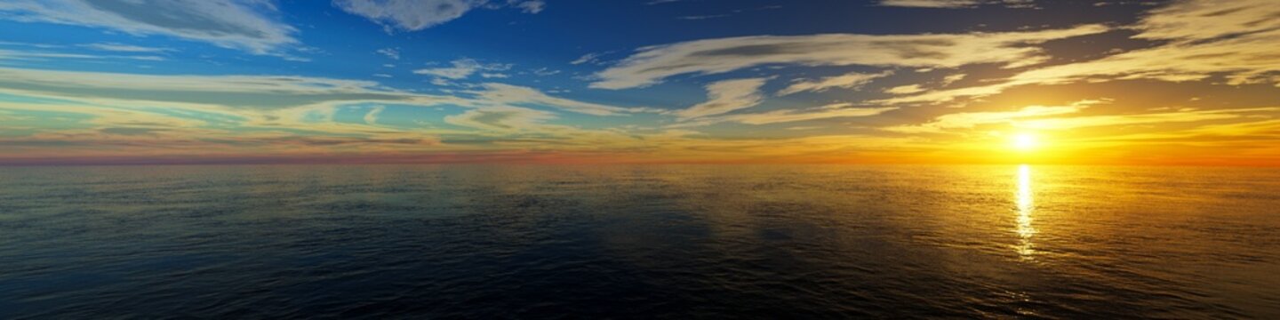 Wide panorama view of sunset or sunrise of open ocean or sea with blue sky and light clouds
