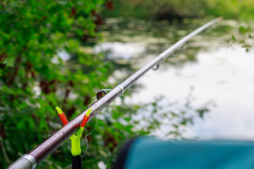 Fishing rod with selective focus on slingshot or prop. Defocused background as copy space