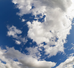 Obraz premium large white clouds in dark blue sky