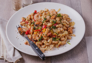 Chilli seafood salad with white beans.