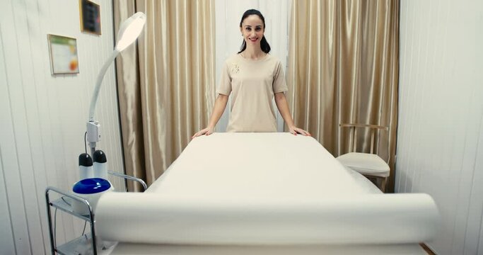 Cosmetology greeting of a woman. Anti aging and wrinkles. Treatment with microcurrent medicine. Skin Care Clinic.