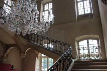 Obraz premium staircase and baroque chandelier at the premontres abbey in pont-a-mousson (france)