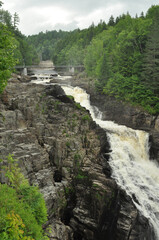Waterfall in the forest crashing down between the rocks