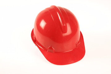 Fototapeta premium A red hard hat on a white background.