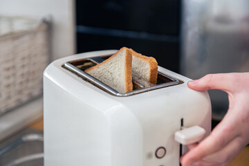 Close-up of slices of bread in a toaster.