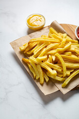 Overhead view of potatoes fries and sauces