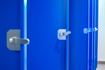 Close-up and general view of new metal lockers in a warehouse locker room