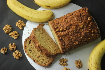 Banana bread made with wholewheat flour and coconut oil. Baked with cinnamon, sugar and walnut for a crunchy top