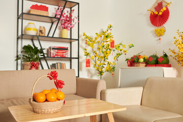 Basket of fresh ripe mandarins on table in living room as a present for Tet