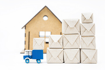 Miniature truck and stuff packages in front of a house