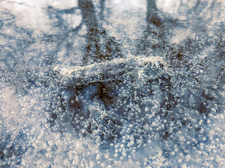 water flowing over rocks and ice in mountain river
