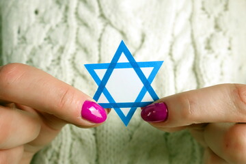 Woman holding David Star. Israel, Judaism, Holocaust, Zionism concept