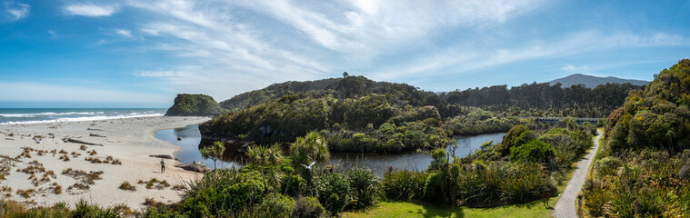 Scenic panorama landscape with beach and forest in New Zealand