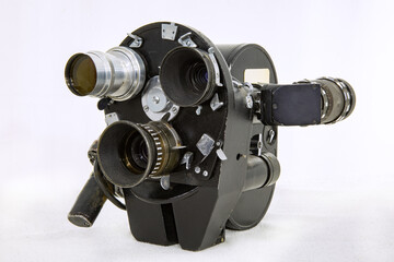 USSR vintage movie camera with three lenses on a white background