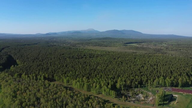 Aerial views of Mount Iremel in cloud, the Southern Urals. Nikolayevka