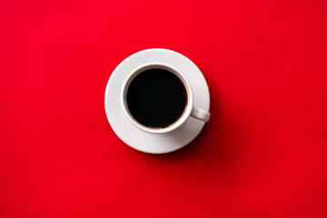 cup of coffee on red background. soft focus.
