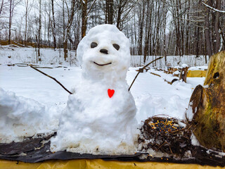 A small snowman was built on our bird feeder station to keep them company.  Windsor in Upstate NY.