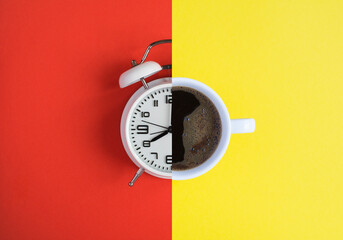 Collage of white alarm clock and coffee cup on the colored background. Top view. Copy space.