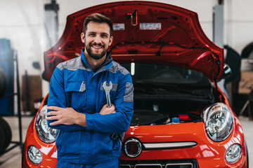 Fototapeta A professional mechanic working in a car service. obraz