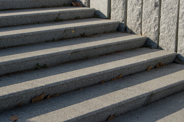 stone stairs with shadow next to a wall