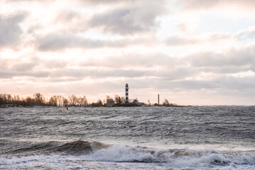 Stormy weather by the sea in Riga, Latvia. Huge waves crashing down the coast of Latvia.