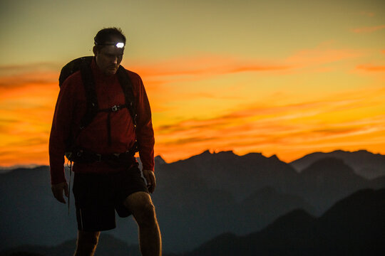 Trail runner on the move via headlamp, Vancouver B.C.