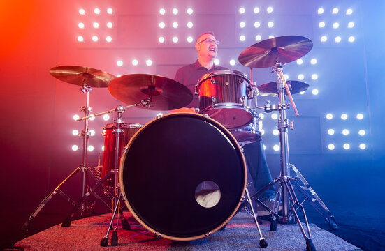 drummer performing in front of audience blinder