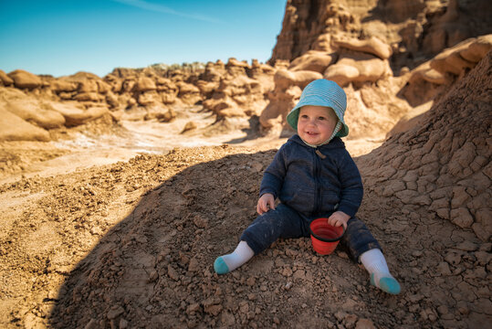 Girl enjoying the shade in the desert