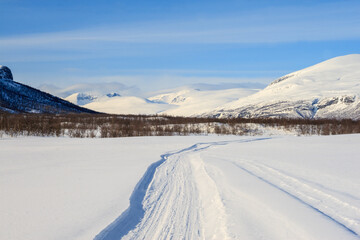 Fototapeta na wymiar snowmobile trail Lapland