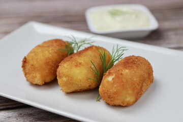 Close up of homemade croquettes, typical spanish dish.