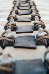 A set of concrete railroad track sleepers with bolts for connection