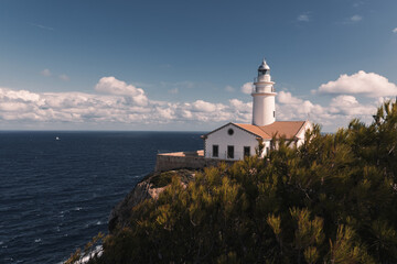Fototapeta na wymiar lighthouse on the coast of the sea of Mallorca
