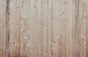 Beige Wood texture as background. Close up of a wooden fence.
