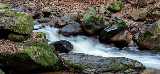 Naklejka na ściany i meble The river Ilse in the Ilsetal with stones and rocks, Ilsenburg, Saxony-Anhalt, Germany