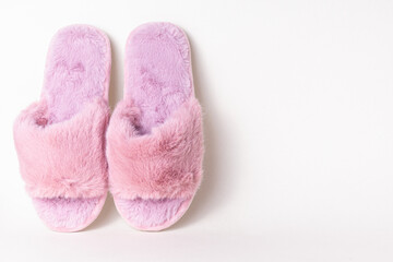Pink women's home slippers. Comfortable shoes for home. Space for text