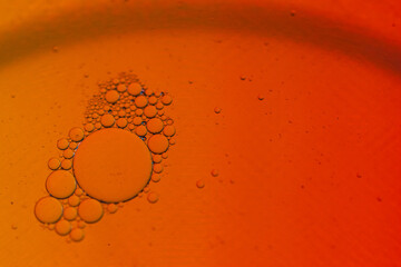 Small and large bubbles on orange background