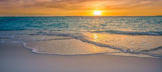 Closeup sea sand beach. Panoramic beach landscape. Inspire tropical seascape horizon. Colorful golden light sunset sky calmness tranquil relaxing sunlight summer vibes. Vacation travel holiday banner
