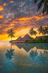 Fantastic poolside, sunset sky, palm trees reflection. Luxury tropical beach landscape, infinity swimming pool, deck chairs and loungers under umbrellas amazing scenic. Vacation resort hotel landscape - obrazy, fototapety, plakaty