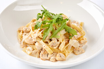 Italian pasta with chicken, cheese and vegetables.