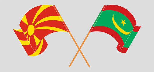 Crossed and waving flags of North Macedonia and Mauritania