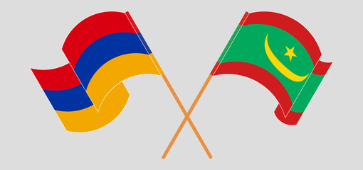 Crossed and waving flags of Armenia and Mauritania