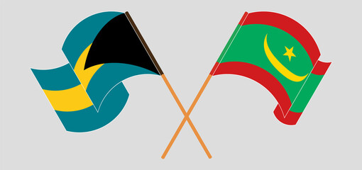 Crossed and waving flags of the Bahamas and Mauritania