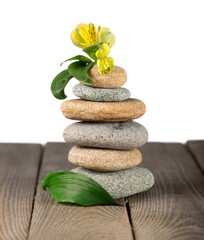 Stack of stones on a wooden desk, zen stone concept
