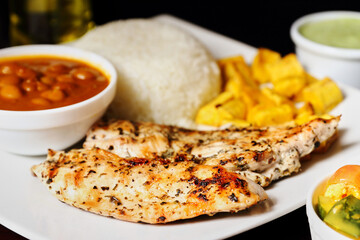 typical ecuadorian food chicken and rice with stew