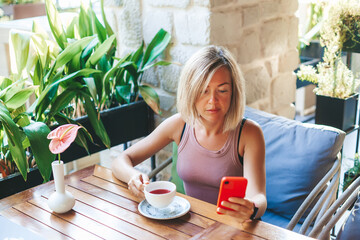 Relaxed woman chatting by the phone