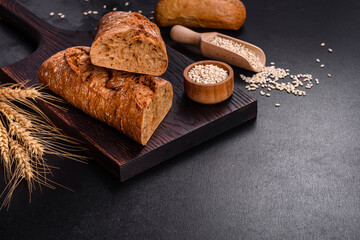 Fresh Bread on black background, top view, copy space